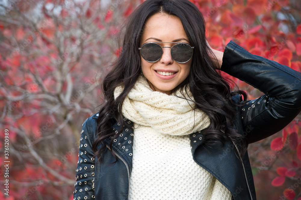 Beautiful woman walking outdoors in autumn. Young woman enjoying autumn weather. Beautiful woman walking outdoors in autumn. Young woman enjoying autumn weather.