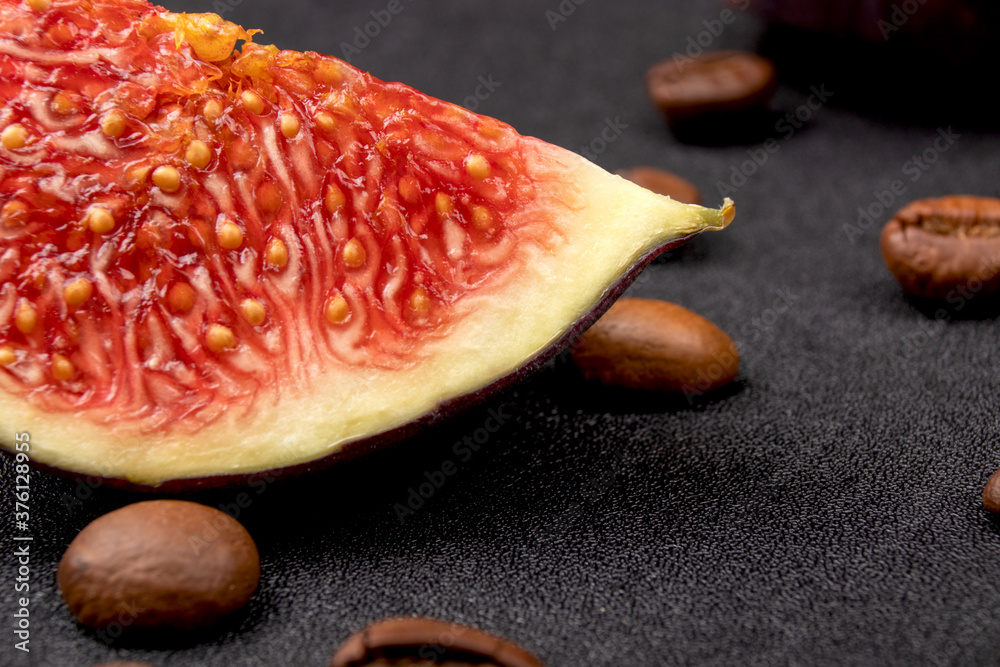 Figs on dark background with coffee beans. Ripe sweet figs. Healthy mediterranean fig fruit. Food concept. Figs on dark background with coffee beans. Ripe sweet figs. Healthy mediterranean fig fruit. Food concept.