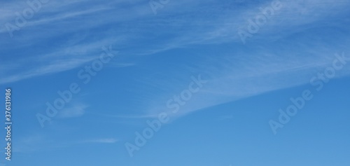 blue sky with wispy clouds