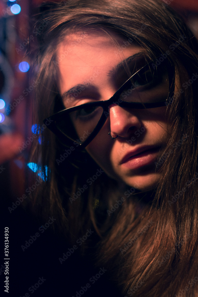 woman with sunglasses in a party 