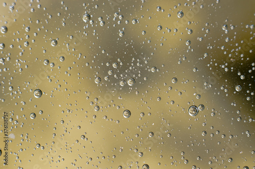 Background of air bubbles on the water surface. Close-up shot of air bubbles in liquid. Selective focus. Extreme close-up images of water bubbles