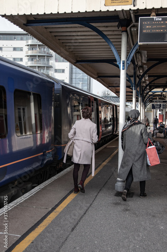 Train passengers or commuters leaving an train at a station