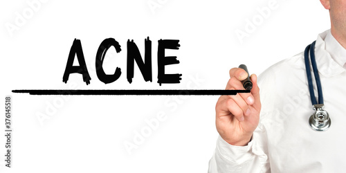 Doctor writes the word - ACNE. Image of a hand holding a marker isolated on a white background.