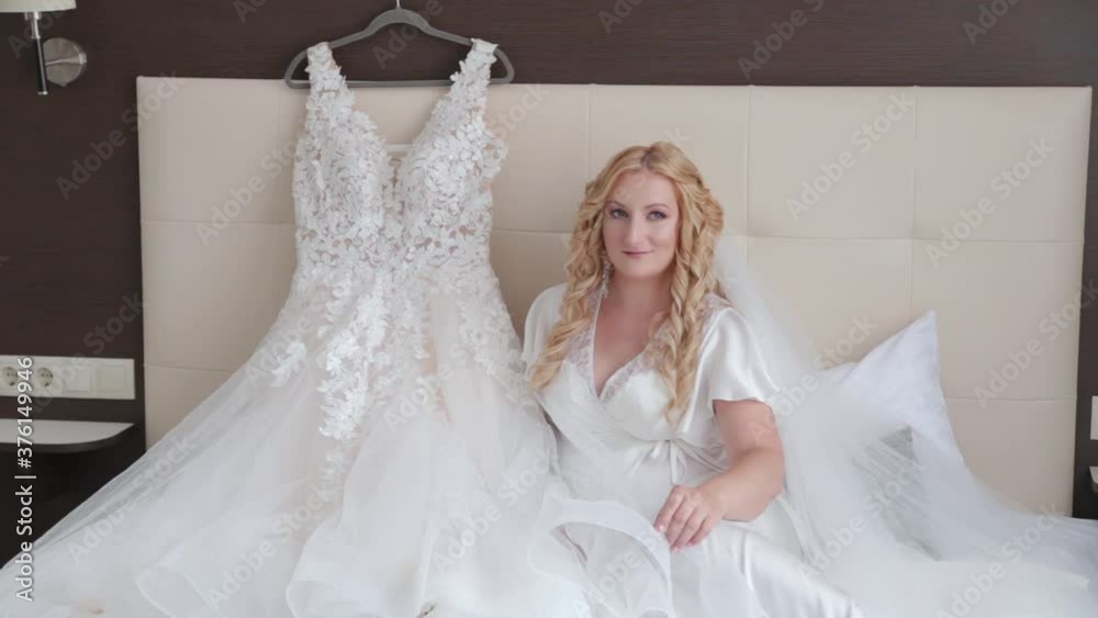 Woman bride on bed posing. Woman bride on bed posing.