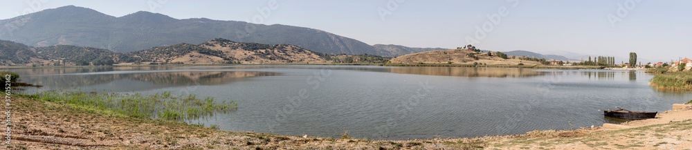Panoramic view of the natural lake Zazari (northwest Greece, Macedonia) and mountains
