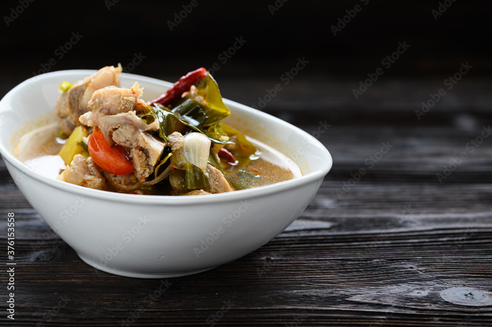 Thai food Pork spare rib Spicy soup in white bowl.