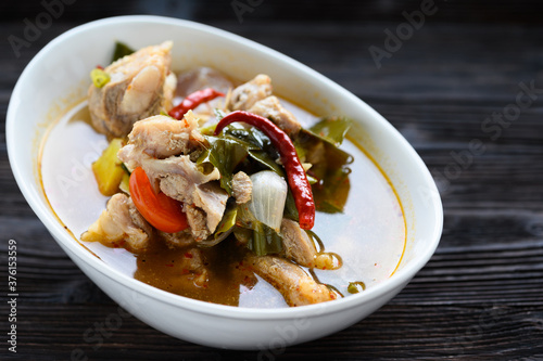 Thai food Pork spare rib Spicy soup in white bowl.