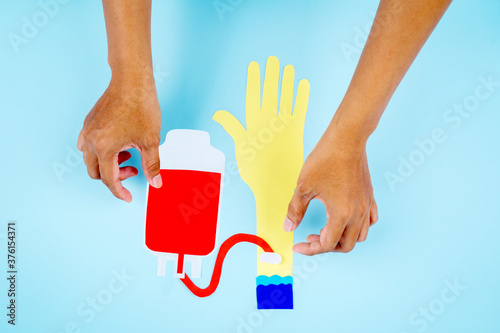 Canvas Print Doctor hands gets blood transfusion from patient