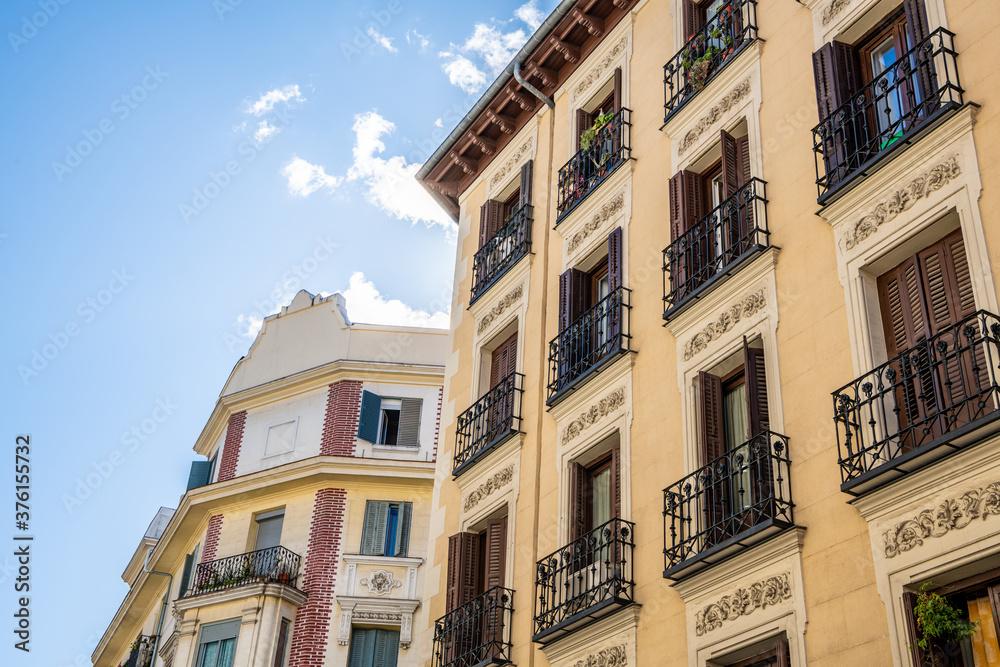 Beautiful architecture in the Malasana area in central Madrid,Spain, with traditional wrought iron balconies.