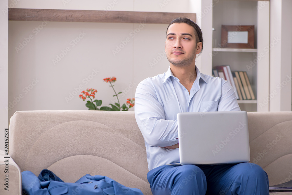 Young male employee working from the house Young male employee working from the house
