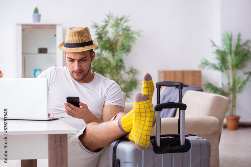 Young man preparing for departure at home Young man preparing for departure at home