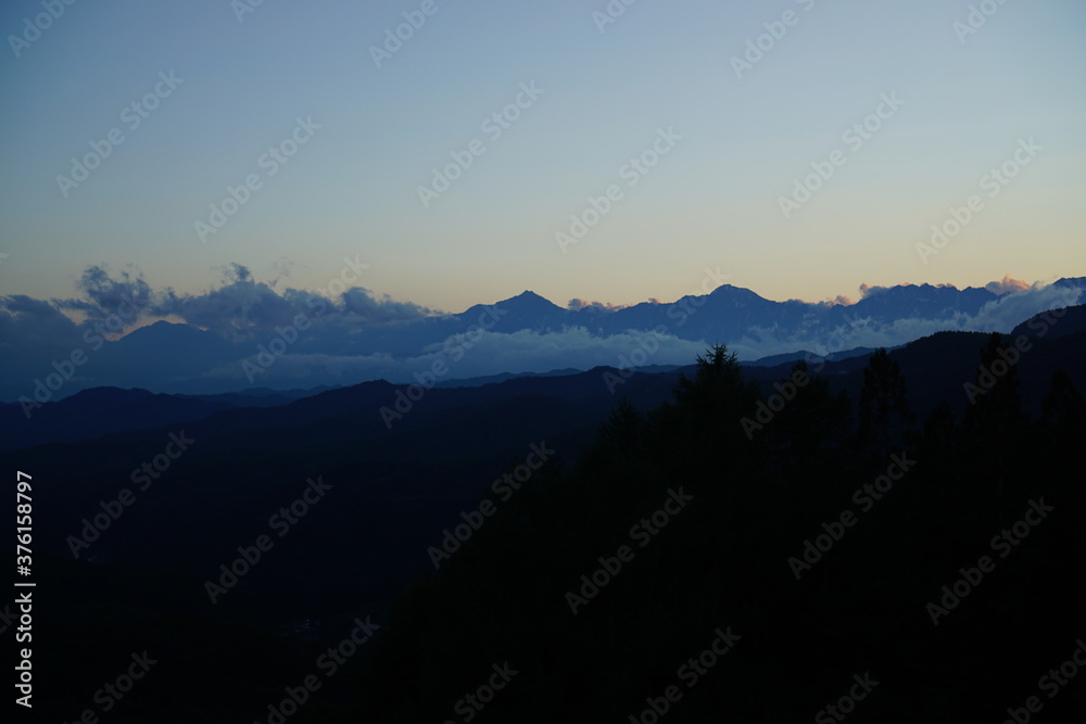 Fototapeta premium Blue sky above high mountain landscape in daytime, Japanese alps, Hakuba, Japan