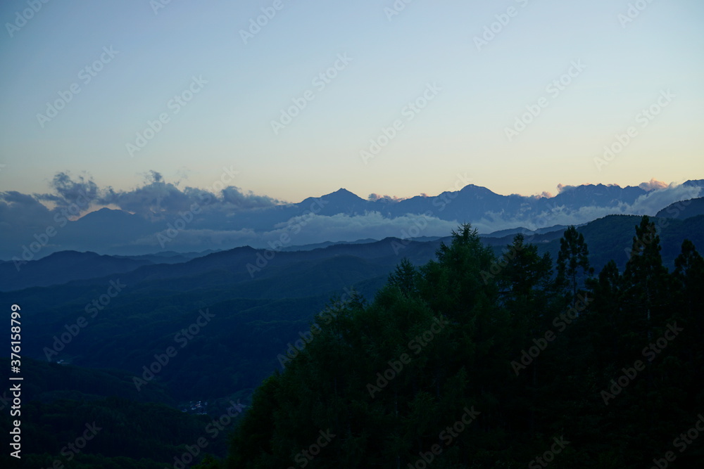 Blue sky above high mountain landscape in daytime, Japanese alps, Hakuba, Japan