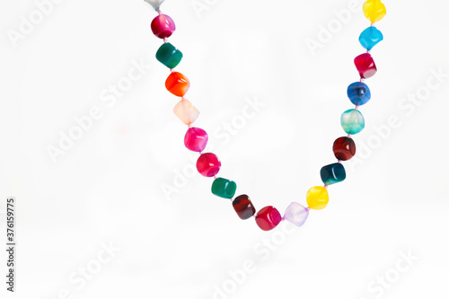 colorful stone necklace on white background