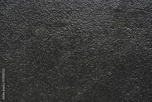 black asphalt texture with dark color and uneven surface