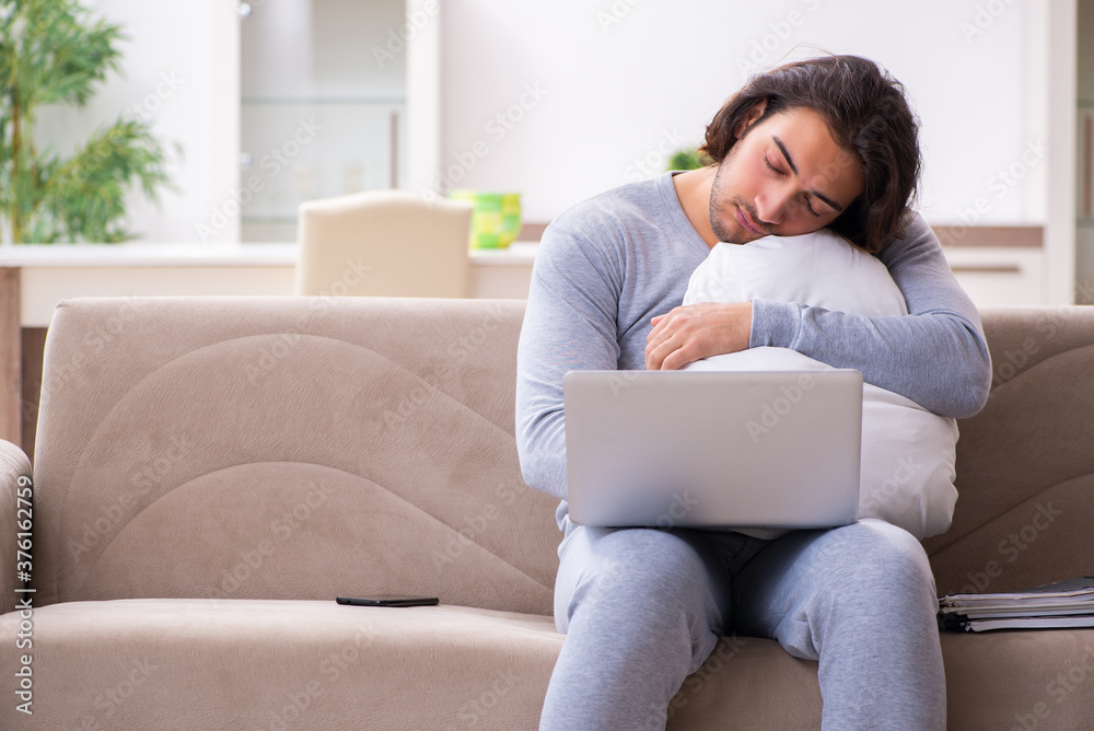 Young male employee freelancer working from home Young male employee freelancer working from home