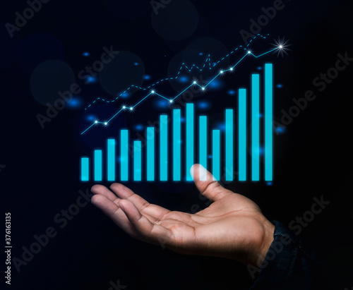 Businessmen stand there with sparkling profits graphs about business concepts that are more profitable and growing.