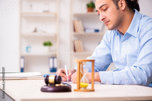 Young man in courthouse in divorcing concept