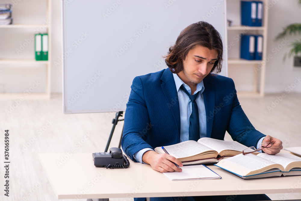Young businessman student studying at workplace