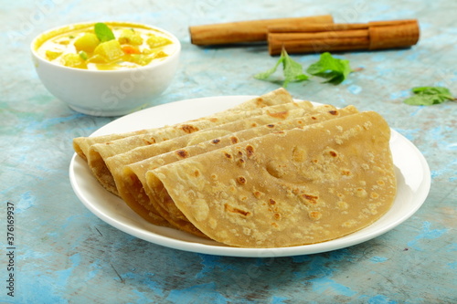 Traditional Indian vegetarian foods- Tasty wheat chapati  and vegetable curry- Healthy meal. photo