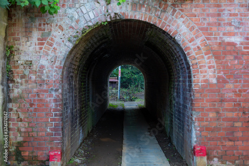 small tunnel made of bricks in town of takao  tokyo  japan
