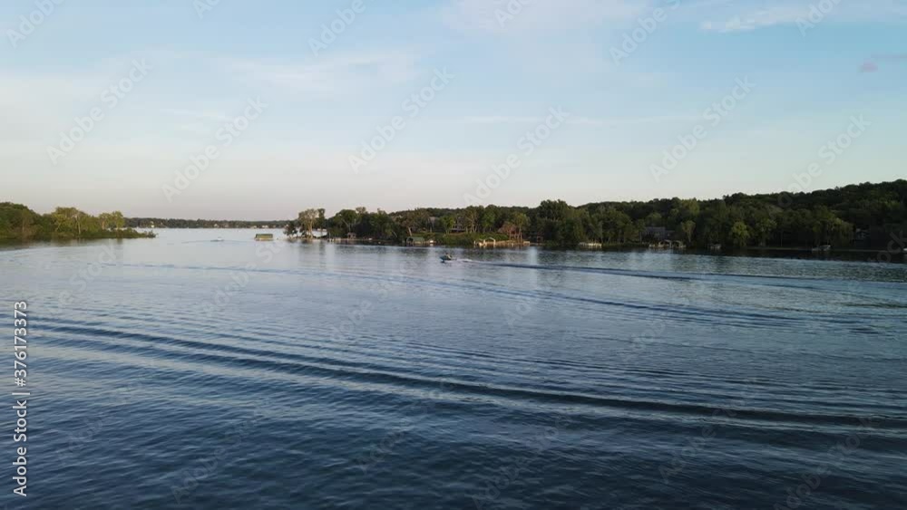 Boat sailing at the lake during the afternoon Boat sailing at the lake during the afternoon