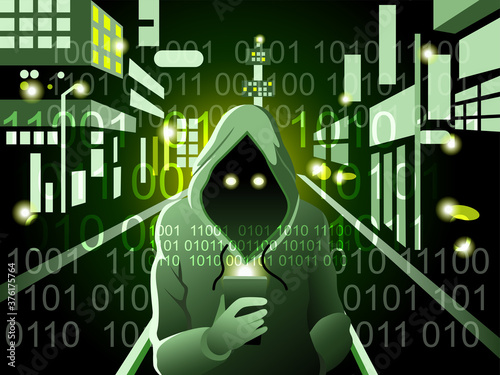 Hacker  in a hood  with mobile phone stealing data...The concept of a criminal.