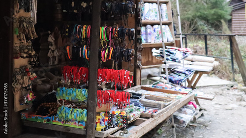 Wallpaper Mural Souvenir market in Yaremche with traditional Carpathian handmade clothing, herbs and wooden tools. Ukrainian textiles, knitted socks, vests, hats. Ukraine, Yaremche - November 20, 2019 Torontodigital.ca