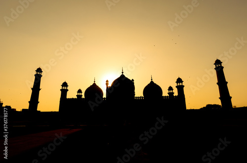 Mughal 17th century Badshahi Mosque during sunset in Lahore, Pakistan