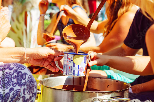 Outdoor festival people having cacao ceremony
