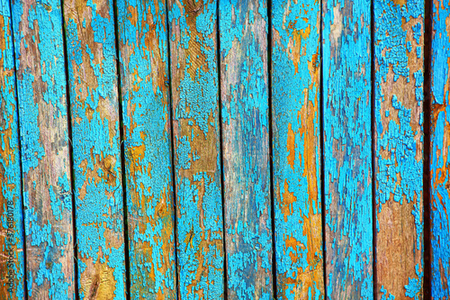 Billede på lærred Old paint with cracks on the fence . Old wooden planks texture
