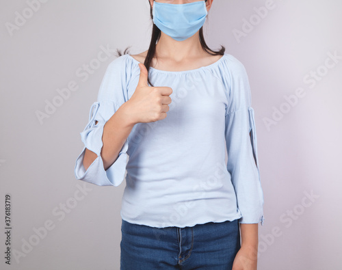 Girl, who has a mask to protect herself from the coronavirus.