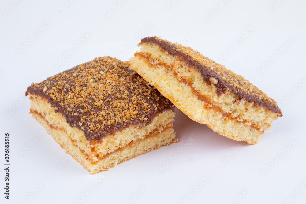 fresh pastry filled with boiled condensed milk, poured with chocolate, isolated on a white background fresh pastry filled with boiled condensed milk, poured with chocolate, isolated on a white background