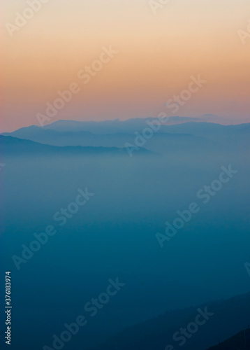 View of the mist-covered mountains. © Oleksiy