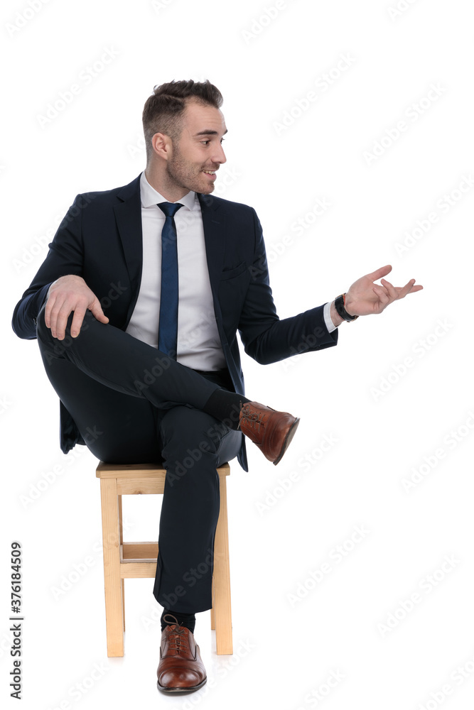 Happy businessman smiling and talking, gesturing Happy businessman smiling and talking, gesturing