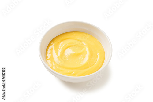 Fototapeta Homemade vanilla custard pudding or lemon curd in a white  bowl  isolated on whi
