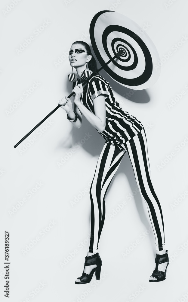 sexy woman in striped costume with spiral umbrella sexy woman in striped costume with spiral umbrella