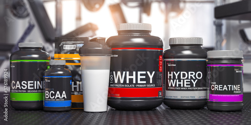 Sports nutrition supplements and chemistry for bodybuilding in gym. Whey protein casein, bcaa, creatine cans. photo