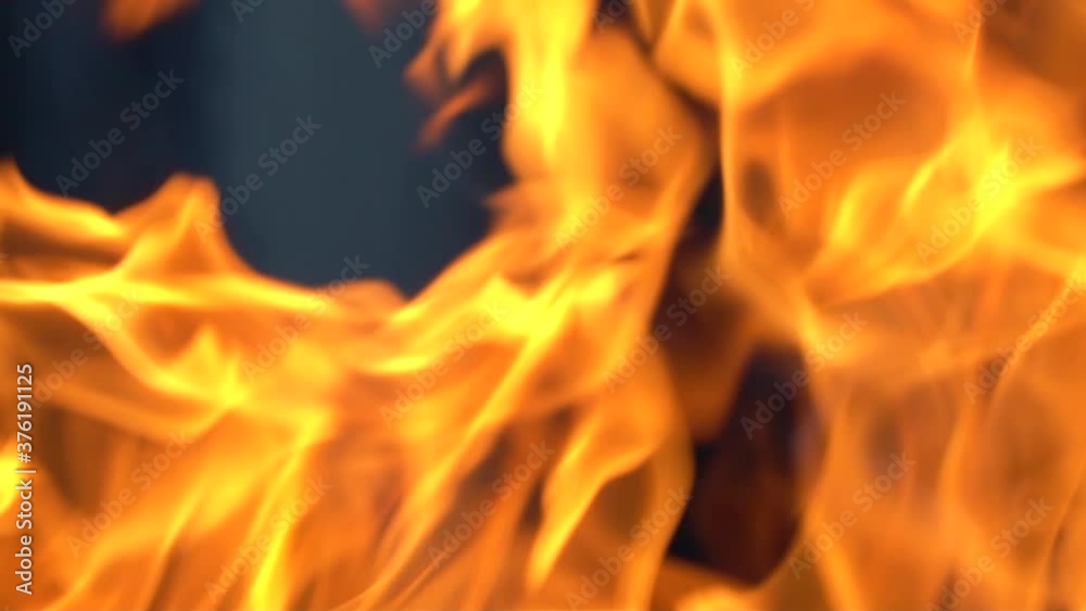 Slow-motion video of fire and flames.A fire pit, burning gas or gasoline burns with fire and flames.Flames and burning sparks close-up,fire patterns.A hellish glow of fire in the dark with copy space Slow-motion video of fire and flames.A fire pit, burning gas or gasoline burns with fire and flames.Flames and burning sparks close-up,fire patterns.A hellish glow of fire in the dark with copy space
