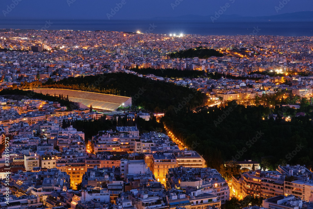 Beautiful night view of Athens, Greece with ancient and restored Panathenaic stadium of Kallimarmaro. Iconic place for Olympic games movement