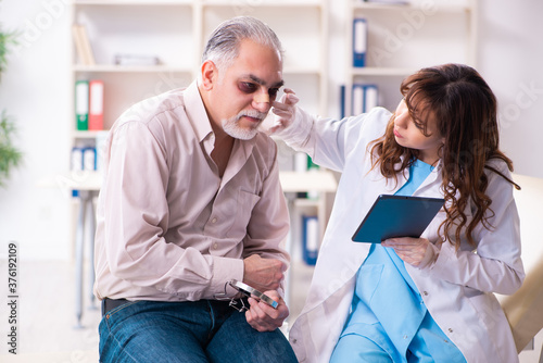 Wallpaper Mural Old man visiting young female doctor for plastic surgery Torontodigital.ca