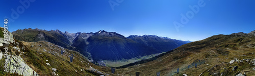 panorama scenery of the swiss alps. Lake at the top of grimsel p photo