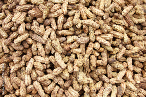 Peanuts seed. Many groundnuts in shells. Peanuts background © songwut