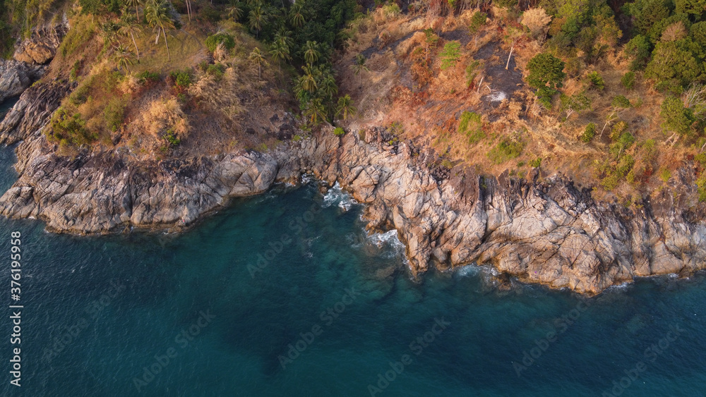 Obraz premium Aerial view. Top view of turquoise sea water washes the rocky shore. Landscape background. Thailand
