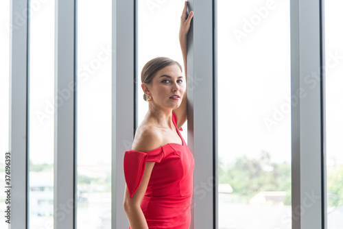Elegance young smart businesswoman standing and looking at camera with confidence Free Download Elegance young smart businesswoman standing and looking at camera with confidence - GFXLoad