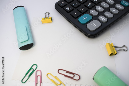 Set of office supplies on a white table  top view. The concept of office and school