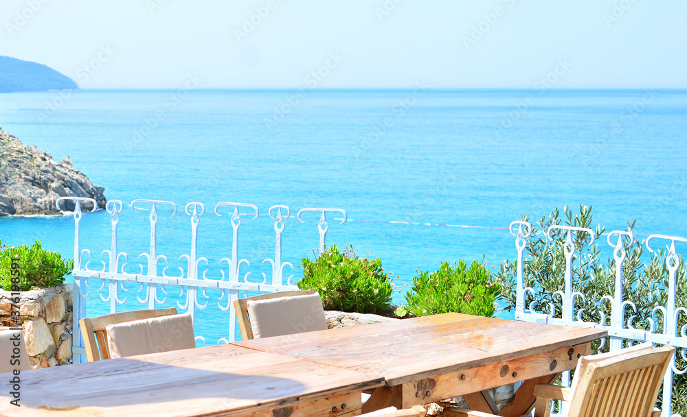 Fototapeta premium Mediterranean landscape. Empty wooden table against the beautiful sea view.