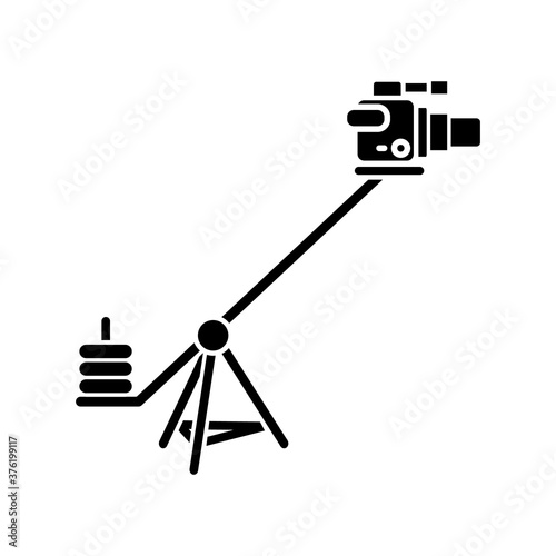Camera crane black glyph icon. Shoot reportage in studio. Professional television shooting. Heavy weight equipment for filmmaking. Silhouette symbol on white space. Vector isolated illustration
