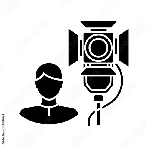 Lighting technician black glyph icon. Professional worker for electrical equipment. Stage spotlight coordination. Broadcasting live. Silhouette symbol on white space. Vector isolated illustration