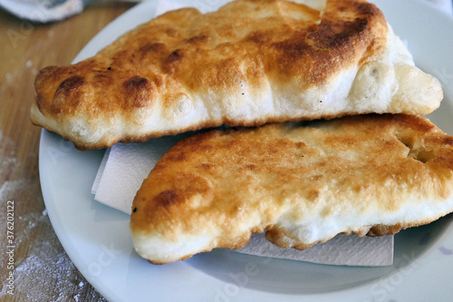 homemade dough fried in oil, fat bagel,